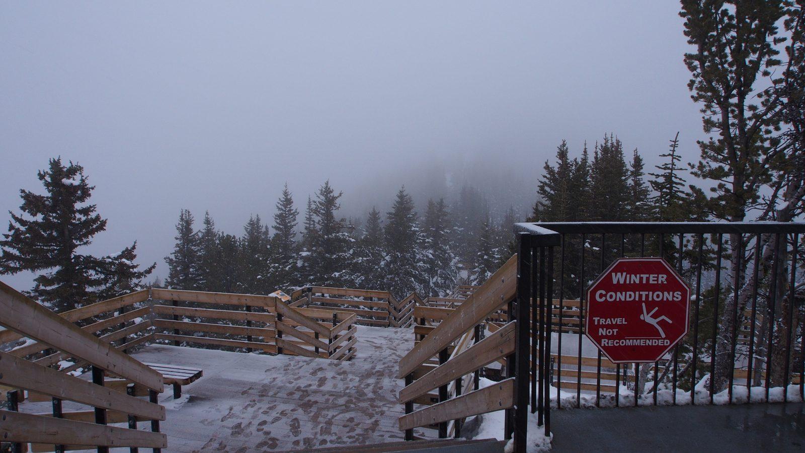 Sulphur Mountain boardwalk with winter conditions travel warning in Banff National Park